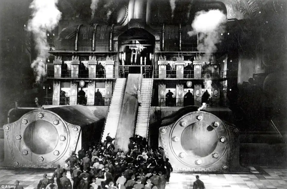 Metropolis filmindeki işçiler, yeraltındaki makine katlarında merdivenlerden ilerliyor.